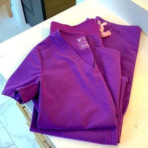 Figs purple scrubs.